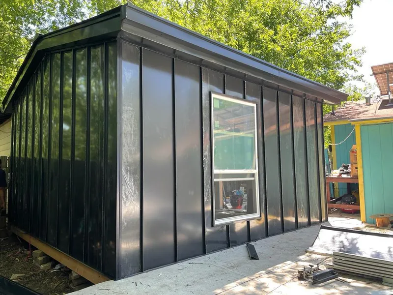 Black standing seam metal wall panels for Roof Inspection in Northport